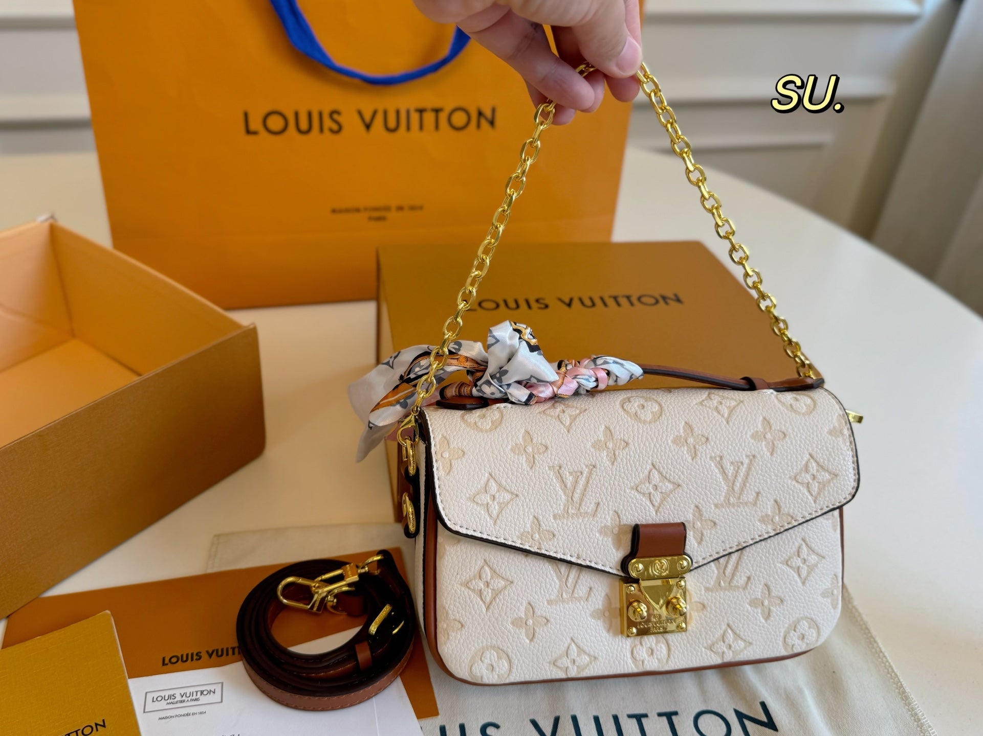 LV Embossed Messenger Bag