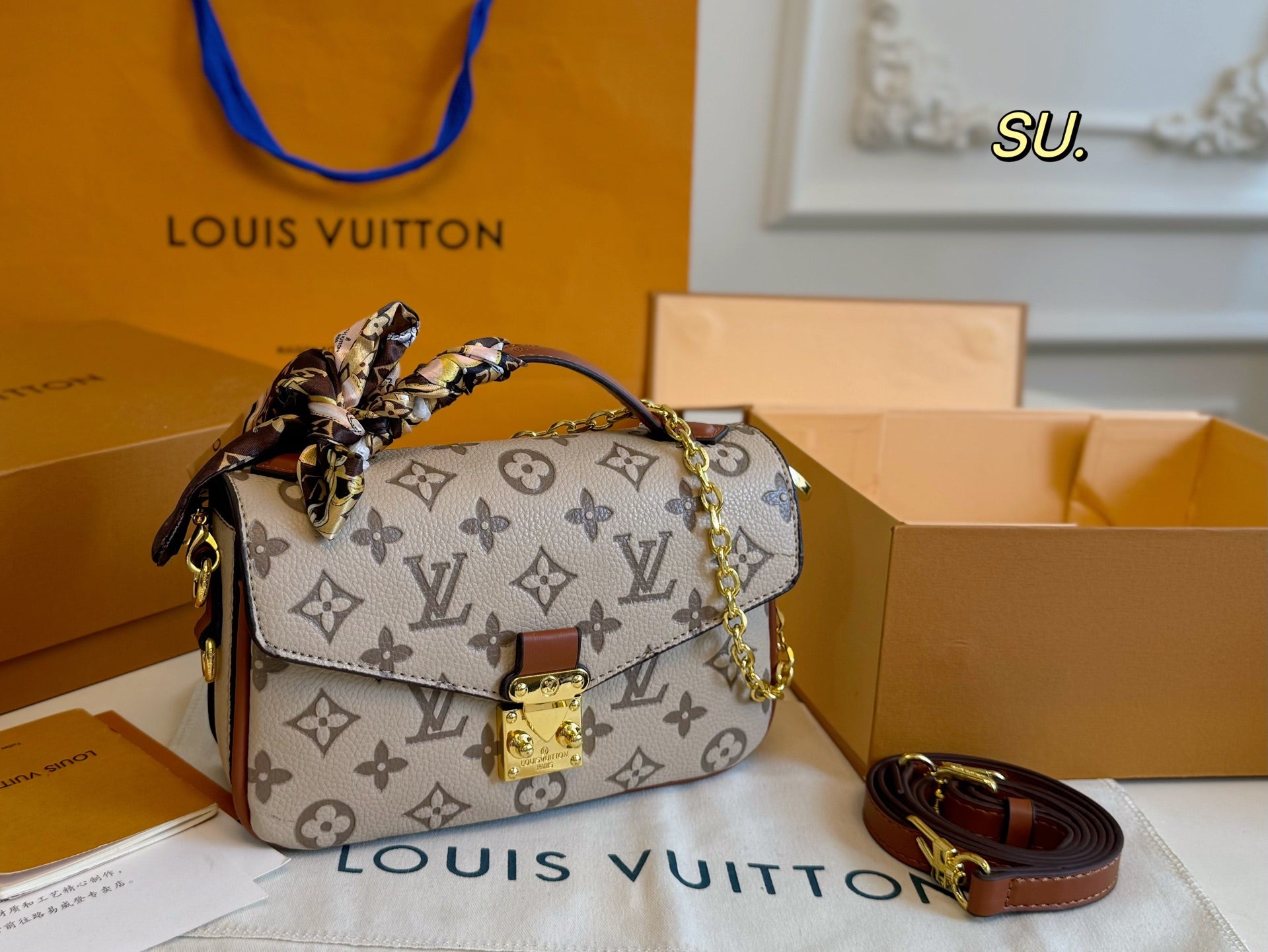 LV Embossed Messenger Bag