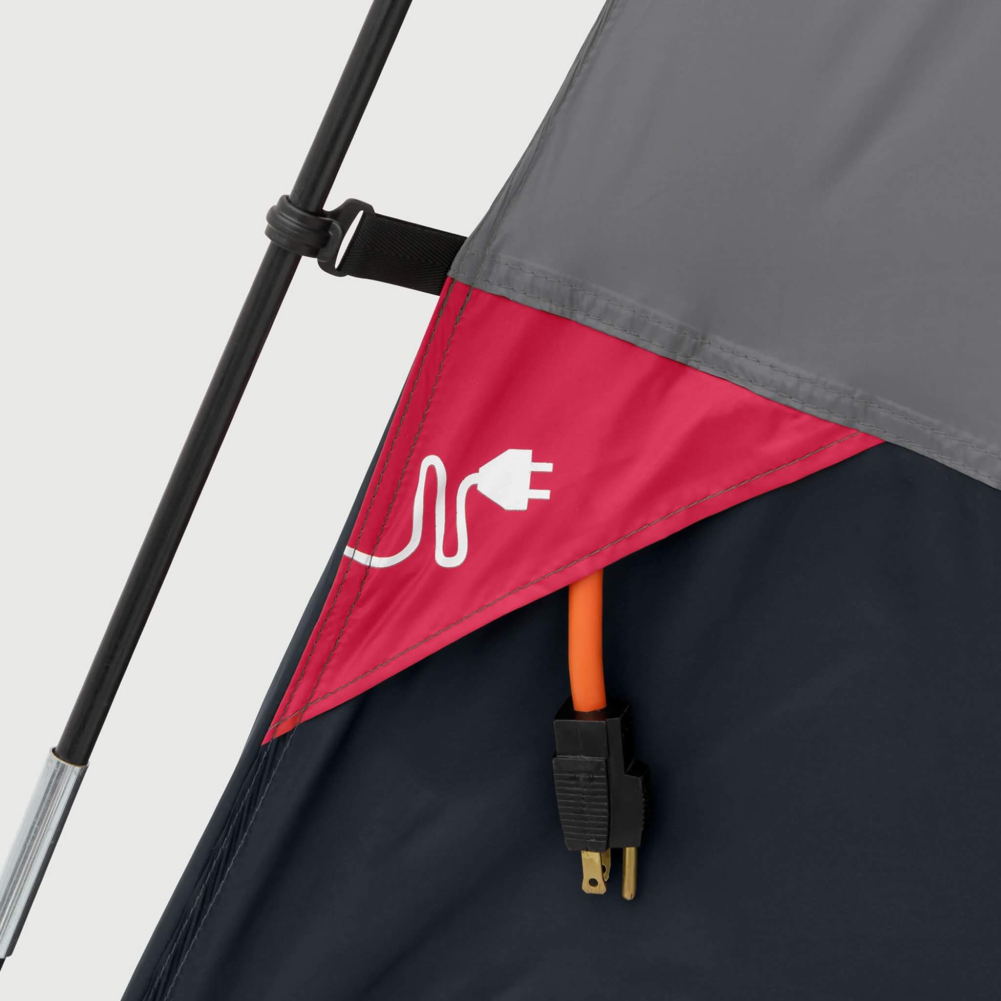 Close-up of CORE 6 person lighted dome tent in gray with red accents, electrical cord access port, shown with reinforced flap for outdoor power connection.